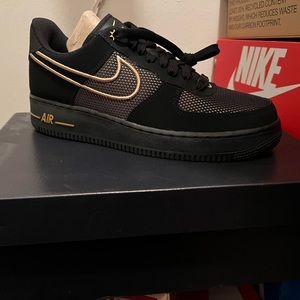 Black and gold Air Force Ones